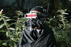 'Prepper' tech: Benny Wicaksono models his cyborg-like mask, 'Proyek Insitu', which was inspired by the masks people wear for protection against COVID-19. (JP/Ivan Darski)