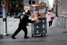Goods are delivered to a store in the financial district of Manhattan in New York City on Oct. 28, 2021. The US economy grew at only 0.5 percent in the third quarter due to the resurgence of the Delta variant and bottlenecks with consumer goods.