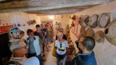 European tourists, escorted by security personnel, visit the old town of Ghadames, a desert oasis some 650 kilometres (400 miles) southwest of the Libyancapital Tripoli, on October 19, 2021, during an organised tour in the town.