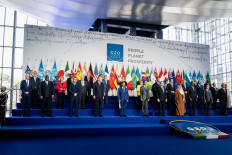 (From left) US President Joe Biden, DR Congo President Felix Tshisekedi, French President Emmanuel Macron, Turkish President Recep Tayyip Erdogan Sultan of Brunei, Hassanal Bolkiah, Indonesian President Joko Widodo, Italy's Prime Minister, Mario Draghi and other world leaders pose during a group photo at the G20 of World Leaders Summit on October 30, 2021 at the convention center 
