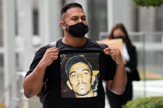  Rapper who spoke out on Singapore racism charged with fanning tensions 