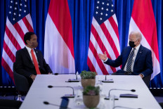 President Joko “Jokowi” Widodo (right) listens as United States President Joe Biden makes a statement for the press before a bilateral meeting at the United Nations Climate Change Conference (COP26) in Glasgow, Scotland, on Nov. 1, 2021.
