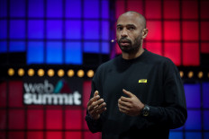 Former French football player Thierry Henry delivers a speech at the main stage of the Web Summit in Lisbon on November 2, 2021. Europe's largest tech event Web Summit is held at Parque das Nacoes in Lisbon from November 1 to November 4.
