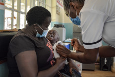 A child gets a malaria vaccination at Yala Sub-County hospital, in Yala October 7, 2021.