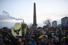People participate in a protest rally during a global day of action on climate change in Glasgow on November 6, 2021, during the COP26 UN Climate Change Conference.