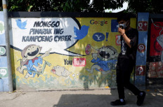Modern neighborhood: A mural welcomes visitors to Kampoeng Cyber. (JP/A. Kurniawan Ulung)
