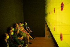 People look at Flower in the Mirror by Kong Khong-chang on the opening day of the M+ art museum in Hong Kong on November 12, 2021.