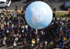 Protesters take part in a climate march in the Israeli coastal city of Tel Aviv, calling on world leaders to take action to reverse climate change, on October 29, 2021, ahead of the COP 26 United Nations Climate Change Conference (UNFCCC) in Glasgow.  (AFP/Jack Guez).
Usage: 0