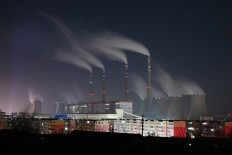 The coal-powered Datang International Zhangjiakou Power Station is pictured at night in Zhangjiakou, one of the host cities for the 2022 Winter Olympics, in China's northern Hebei province on November 12, 2021.
