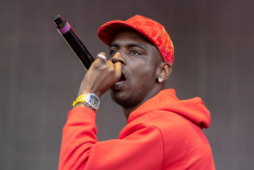 In this file photo taken on November 9, 2019 US rapper Young Dolph performs during the Astroworld Festival at NRG Stadium in Houston, Texas. US rapper Young Dolph was fatally shot on November 17, 2021 while inside a cookie store in Memphis, Tennessee, local authorities said. The 36-year-old rapper, born in Chicago and raised in Memphis, had just entered Makeda's cookie shop, where he was a regular, when a gunman drove up and shot him, local media reported.
