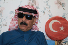 Syrian singer Omar Souleyman poses at his home after his release in Sanliurfa, southeast Turkey on November 19, 2021. Souleyman was released after he was detained over alleged links to Kurdish militants, an AFP photographer said. Souleyman was detained on Novemer 17, 2021 in Sanliurfa, where he has been running a bakery since escaping Syria's civil war which began in 2011.