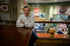 French chef and restaurateur Daniel Boulud poses for a photo in the office of his restaurant 'Daniel', in Manhattan, New York city on November 19, 2021. french chef Daniel Boulud, who has been living in New York for almost 40 years, was named best restaurateur in the world by Les Grandes Tables du Monde on Monday for his flagship restaurant 
