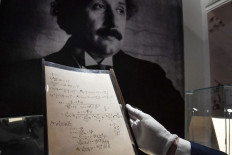 A picture taken on November 22, 2021 shows pages of one of the preparatory manuscript to the theory of general relativity of Albert Einstein, during their presention a day before being auctionned at Christie's auction house in Paris.