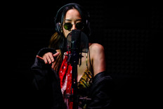 This picture taken on October 9, 2021 shows Malaysian hip-hop artist Nur Batrisya Mohammad Nazri, known as SYA, rehearsing after an interview with Agence France-Presse (AFP) at a studio in Kuala Lumpur.