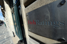 The entrance of a Fitch Ratings office in Paris is pictured on Aug. 8, 2011. The firm expects Indonesia's GDP to grow nearly 7 percent next year.