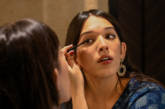 In this picture taken on November 13, 2021, doctor Trinetra Haldar Gummaraju gets ready before an interview with AFP in Mumbai. Transgender activist, surgeon in training and Instagram influencer: at just 24, Indian doctor Trinetra Haldar Gummaraju has worn many hats. But one thing has remained constant.
