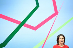 Co-leader of Germany's Green Party (Die Gruenen) Annalena Baerbock delivers a speech at the party's meeting with their members in the federal states on the results of the coalition negotiations, in Berlin on November 25, 2021. 