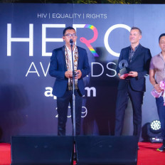 Hero: Asep (front, speaking) receives an HIV Hero Award from the Bangkok-based APCOM in 2019.