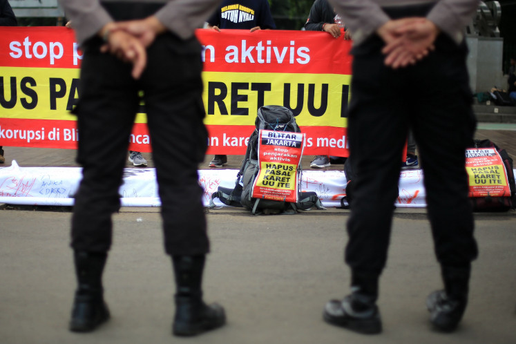 Speaking out: Activists rally outside the State Palace on Jan. 8, 2019, to demand that the government abolish articles in the Electronic Information and Transaction (ITE) Law they deem to be a threat to freedom of expression.