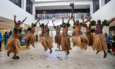 Traditional dancers in grass skirts welcome holidaymakers in Nadi on December 1, 2021, as Fiji opens its borders to international travellers for the first time since the Covid-19 pandemic swept the globe and devastated its tourism-reliant economy.