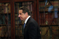 New York Governor Andrew Cuomo walks onto stage at an event at New York University (NYU) where he signed into law a new affirmative sexual consent policy to combat campus sexual violence on July 7, 2015 in New York City. 