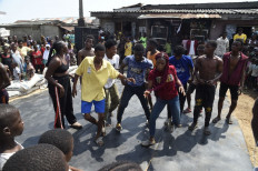 In poor Lagos district, 'slum party' brings hope and life