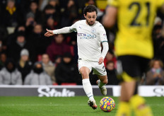 Manchester City's Portuguese midfielder Bernardo Silva scores his team's third goal during the English Premier League soccer match between Watford and Manchester City at Vicarage Road Stadium in Watford on Dec. 4, 2021.