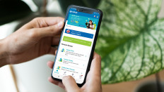 A user operates Cakap, a homegrown language learning app, on a mobile phone. 