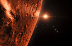 A handout photo released by the European Space Agency on August 31, 2017 shows an artist's impression of the view from the surface of one of the planets in the TRAPPIST-1 system. At least seven planets orbit this ultracool dwarf star 40 light-years from Earth and they are all roughly the same size as the Earth. Several of the planets are at the right distances from their star for liquid water to exist on the surfaces. This artist’s impression is based on the known physical parameters of the planets and stars seen, and uses a vast database of objects in the Universe.