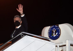 United States Secretary of State Antony Blinken boards an aircraft as he departs for Kuala Lumpur from Soekarno-Hatta International Airport on the outskirts of Jakarta, on Dec. 14.