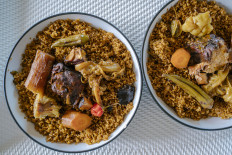 A picture shows thieboudiene plates, also known as Ceebu jën (literally 