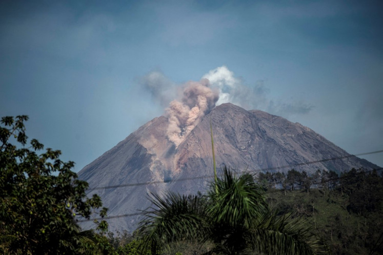 Mount Semeru is seen on Dec. 10, 2021, from the village of Curah Kobokan in Lumajang, after the volcano erupted on Dec. 4 killing at least 39 people. 