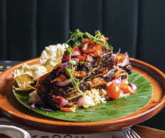 Ribs: One of FLYNN Dine & Bar Jakarta's signature dishes is US grilled short ribs. (Photo Courtesy of FLYNN Dine & Bar Jakarta)