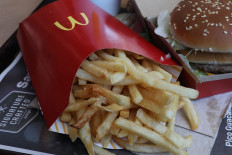In this photo illustration, a McDonald's Big Mac and french fries are seen on a tray on April 30, 2018 in Miami, Florida. The fast-food restaurant reported today that earnings and sales beat expectations. 