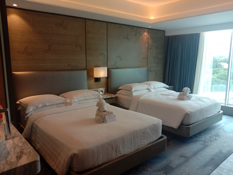 Comfort: Yogyakarta Marriott's deluxe double guest room with a pool view. (Courtesy of Radhiyya Indra)