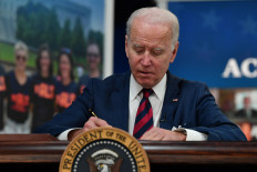 US President Joe Biden signs the “Accelerating Access to Critical Therapies for ALS Act" in the White House in Washington, DC on Dec 23, the same day he signed the Uyghur Forced Labor Prevention Act.
