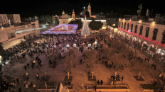 People visit Manger Square on Dec. 24, 2021 in the biblical city of Bethlehem in the occupied West Bank. The square is an extension of the Church of the Nativity, revered as the site where Jesus Christ was born.