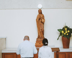 Devotion: Two Catholic converts profess their faith in a cathedral in Jakarta. (Courtesy of Wega Wicaksono)