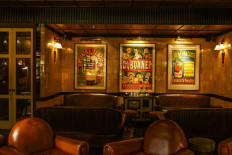 Vintage: The interior of The Cocktail Club is decorated with 18th-century posters. (Photo Courtesy of The Cocktail Club)