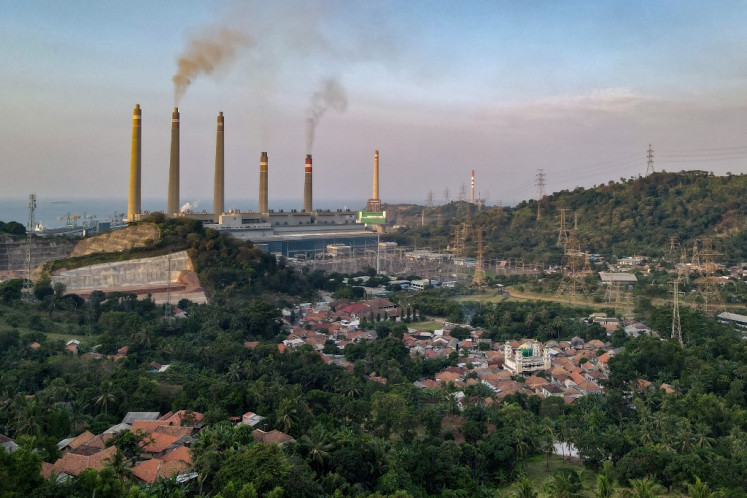 Smoke rises from the Suralaya coal power plant on Sept. 21, 2021 into the skies above nearby villages in Cilegon, West Java.