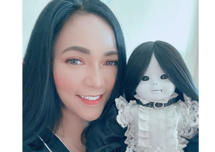 Baby mama: Furi Harun is one of the country's most popular spirit doll owners. (Courtesy of Furi Harun)