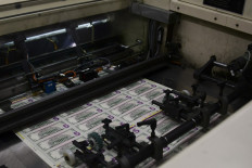 Sheets of US$5 notes run through the automated printing process at the US Treasury's Bureau of Engraving and Printing in Washington, DC, on July 20, 2018.