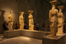 People visit the Athens Acropolis Museum as the museums and archaeological sites open at night for two days, on August 22, 2021.