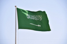 A picture taken on September 22, 2020 shows a Saudi national flag in Riyadh. 