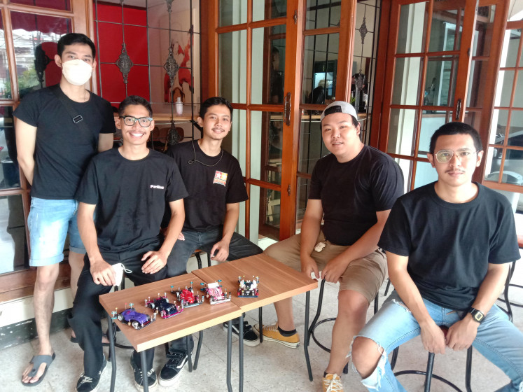 Racing on: The Parlente Tamiya racing team, considered juniors among other Tamiya racers, pose with their Mini 4WDs at a race held on Jan. 9, 2022 in Kemang, South Jakarta. (Courtesy of Radhiyya Indra)