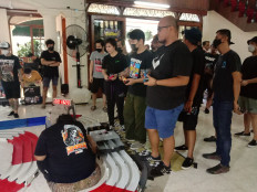 For all ages: Tamiya enthusiasts wait in line to take their Mini 4WD out for a spin. (Courtesy of Radhiyya Indra)