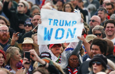 A supporter holds a 'Trump Won' sign at a rally by former President Donald Trump at the Canyon Moon Ranch festival grounds on January 15, 2022 in Florence, Arizona. The rally will mark Trump's first of the midterm election year with races for both the US Senate and governor in Arizona this year. 