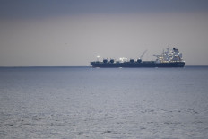 US oil prices slide below $70 a barrel