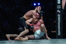 Russian grappler Saygid Izagakhmaev (left) tries to submit James Nakashima in their MMA bout at ONE: HEAVY HITTERS on Jan. 14, in Singapore