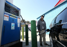 Nikolai Kunz pumps biodiesel into his car at Dogpatch Biofuels on March 22, 2013 in California, US. California is one of the nation's leaders in venture capital funding for green technology, green tech patents and the growth in clean power generation, resulting in reduced greenhouse gas emissions despite a growth in population. 